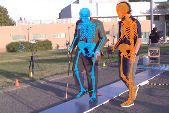 Two people walking with skeletal view.