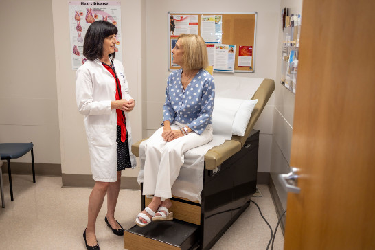 Amparo Villablanca, M.D. a Cardiologist, is consulting with a female patient