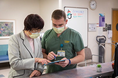 Nurse and patient looking at chart