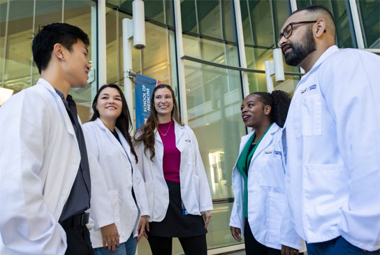 UC Davis Health medical students gathering together.