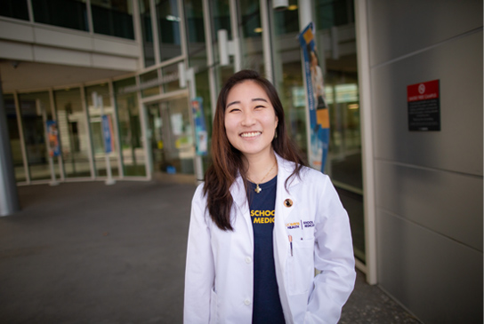 A medical student smiling.