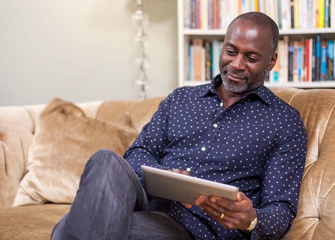 managed care, man with tablet