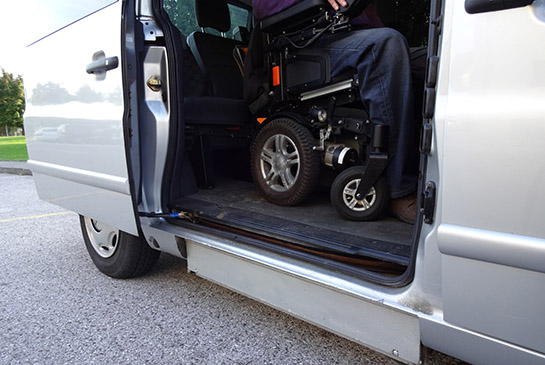 A van with a wheelchair inside
