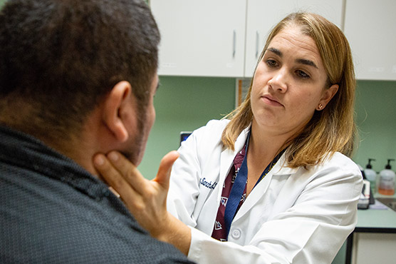 A doctor assessing a patient 