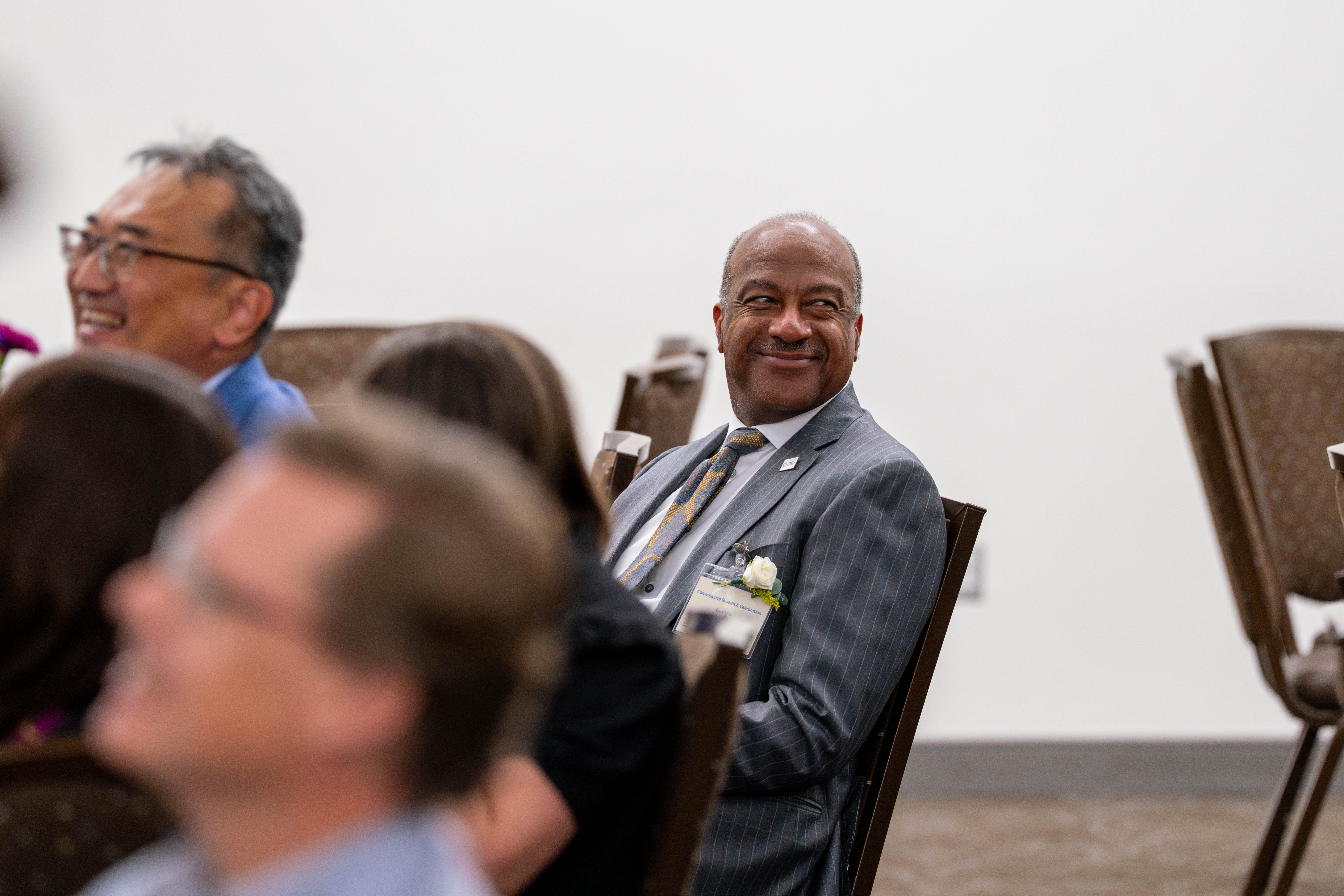 UC Davis Chancellor Gary S. May leans back in a chair and smiles