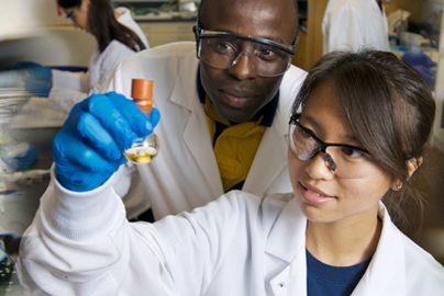 two researchers in a lab setting