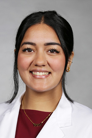 Portrait of medical student Sonam Kumari in white coat and smiling