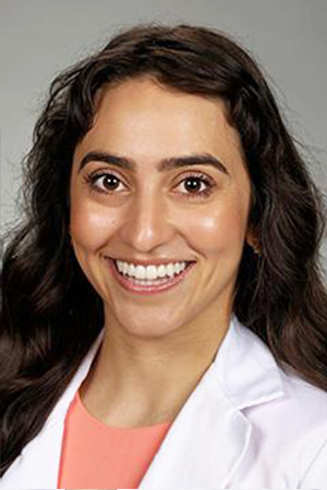 Portrait of medical student Maité Garcia in white coat and smiling