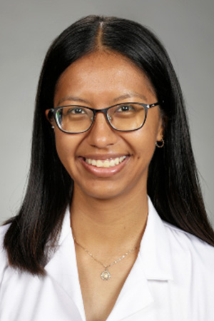 Portrait of medical student	Abigail Vidrio in white coat and smiling
