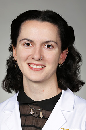 Portrait of medical student Elizabeth Ober in white coat and smiling