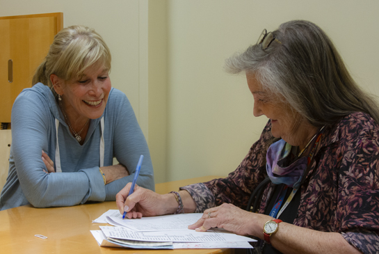 clinician working with a patient in a clinic room