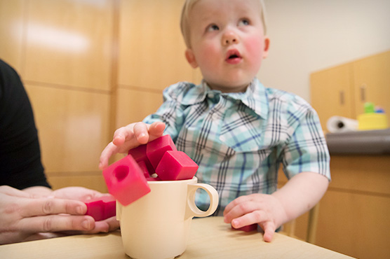 boy playing with blocks at the MIND Institute