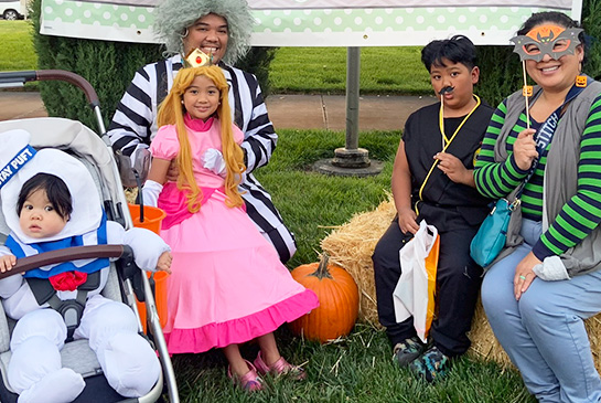picture of family dressed in halloween costumes