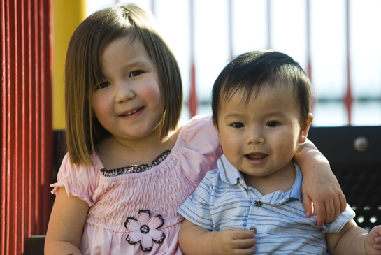 two children hugging on playground