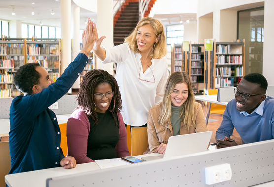 students in library with teacher