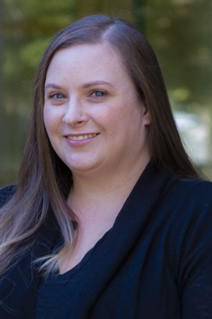 Ashley Ratcliffe-Ikemiyagi smiling in a professional headshot