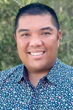 Ellery Santos, M.D., M.P.H. smiling in a professional headshot