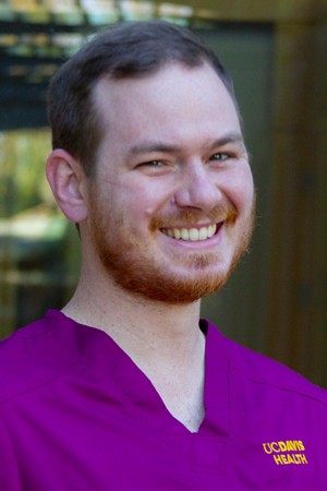 Tim Sullivan smiling in a professional headshot