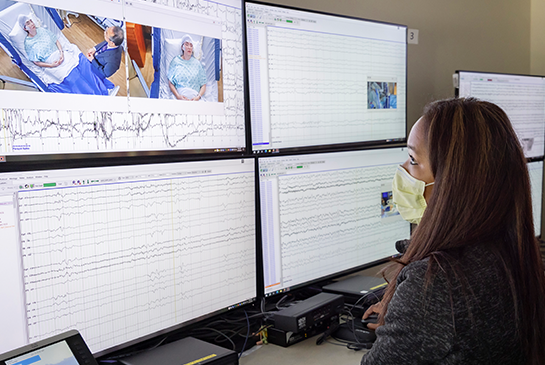 woman looking at eeg screen
