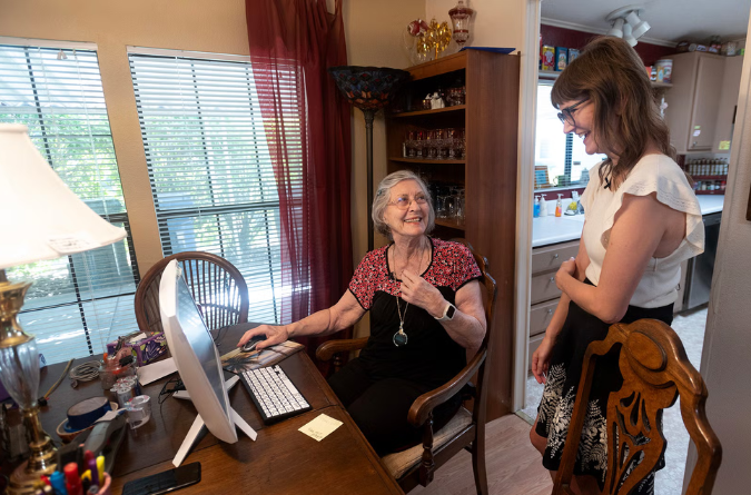 Scientist helping elderly use technology