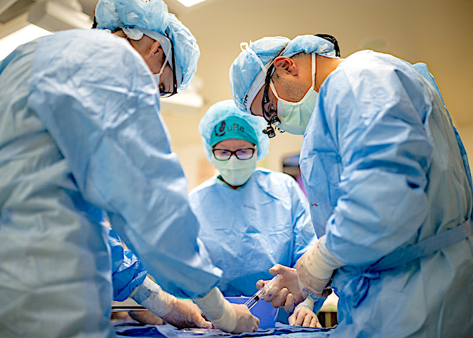doctors performing surgery