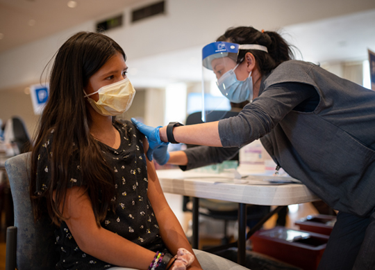 A patient getting vaccinated.