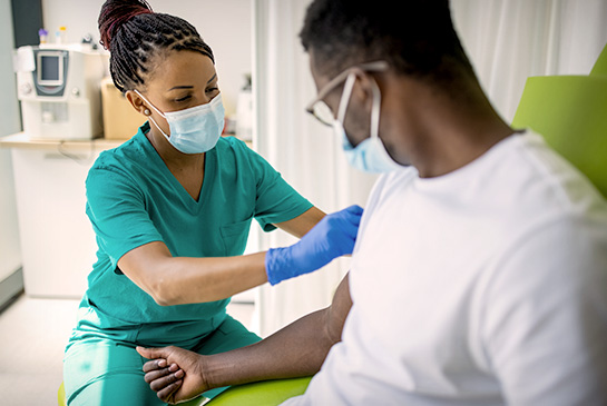 Nursing taking blood from male patient