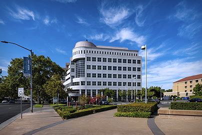 UC Davis Health Glass Rock Building, large beige building with many windows.