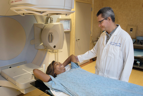 Female patient smiling at male doctor before receiving treatment