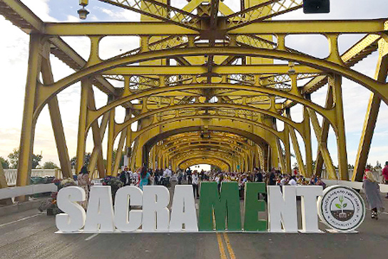 Tower bridge with the word Sacramento in large letters