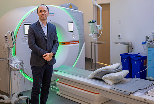 Cardiothoracic Imaging Chief Ahmadreza  Ghasemiesfe with the new photon-counting CT scanner at UC Davis Health’s 48X Complex.