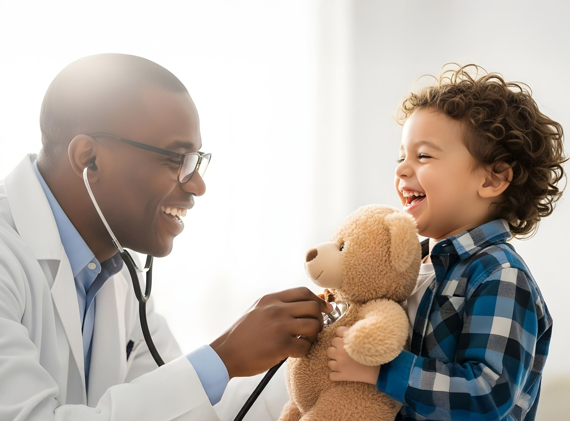 doctor with a child who is holding a bear