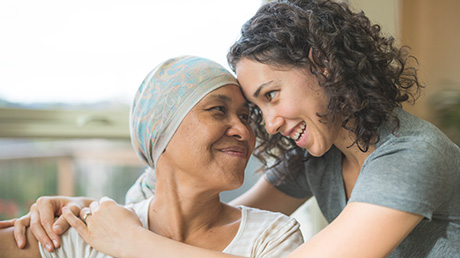 cancer patient and daughter hugging