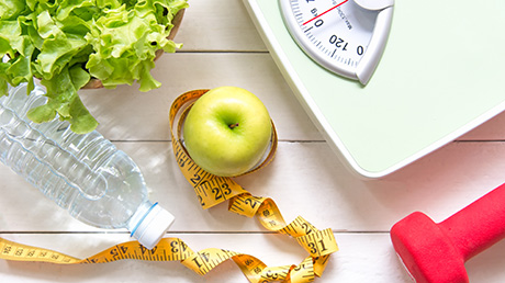 collage of a water bottle, apple, and scale