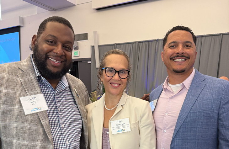Piri Ackerman, center, says seeing former students and mentees succeed is one of the greatest joys of her career.